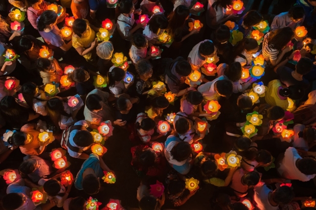 Group of people holding candles