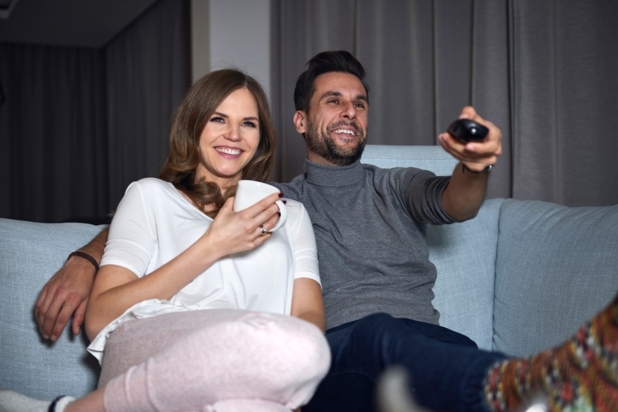 Couple with TV remote