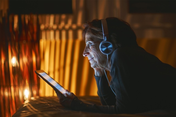 Woman watching on a tablet